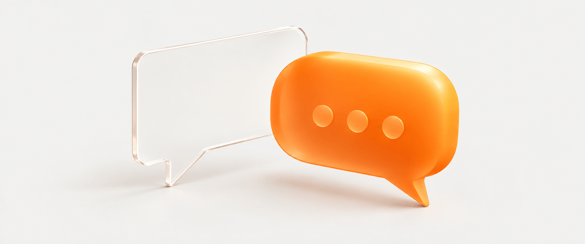 Two speech bubbles, one clear glass and one orange